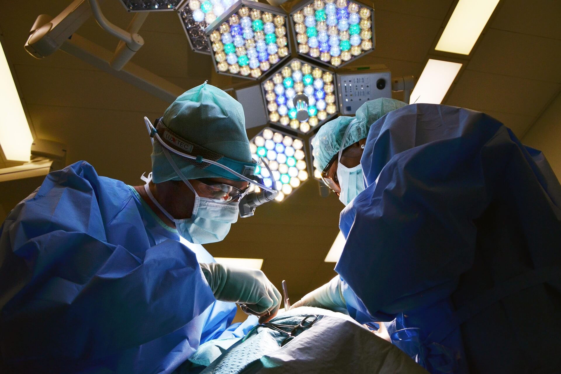 Surgeons performing a medical procedure in an operating room