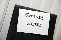 text book with the words manager wanted on the front